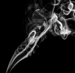 Twisted plumes of smoke, smoke movement on a black background. Abstract smoke lines