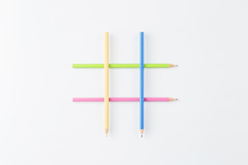 Wooden pencils folded in the form of a hashtag.