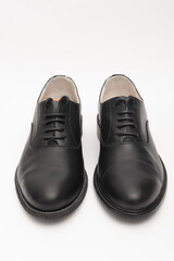 Black men's shoes on a white background