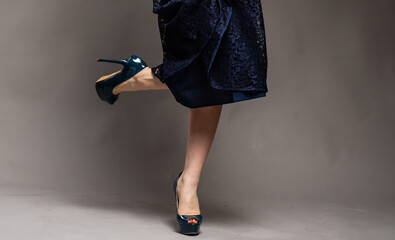 Perfect female legs wearing high heels