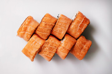 Sushi roll set with salmon, tuna and cream cheese close-up. Traditional Japanese cuisine.