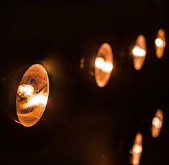Vintage wall lamps close-up on a black wall