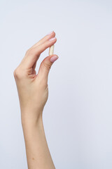 woman hand hold drag or medicine on white background