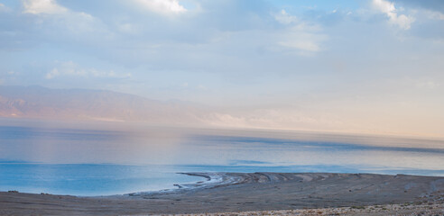 mountains and dead sea at sunset of a sunny day