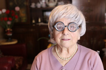 Senior woman wearing quite thick eyeglasses