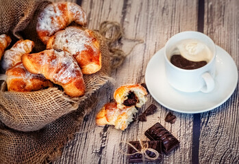 Fototapeta na wymiar croissant with chocolate, breakfast, snack, Coffee with croissant, chocolate