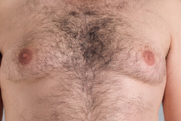 Close up look of a caucasian man hairy chest, with overweight