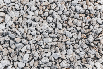 Clean White Pebbles texture. Small stones on the ground. Top view. backdrop