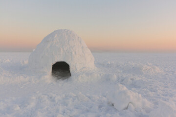 igloo on the snow in winter at sunset, Novosibirsk, Russia