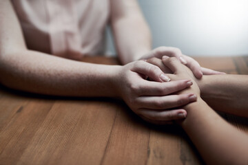 Youll always have my support. Shot of two people holding hands in comfort.