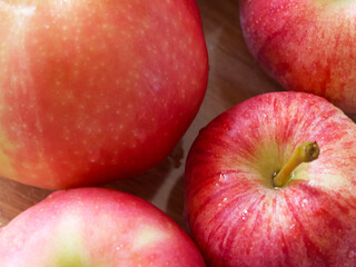 Macro photo of ripe red apples of gala and Ligol varieties. Apple close-up.