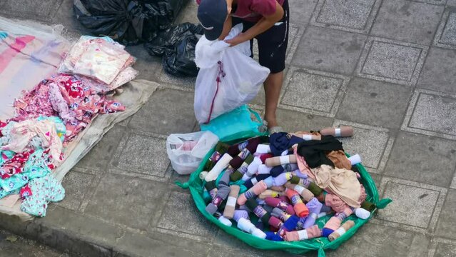 Moroccan man preparing female products to sell them in the street market
