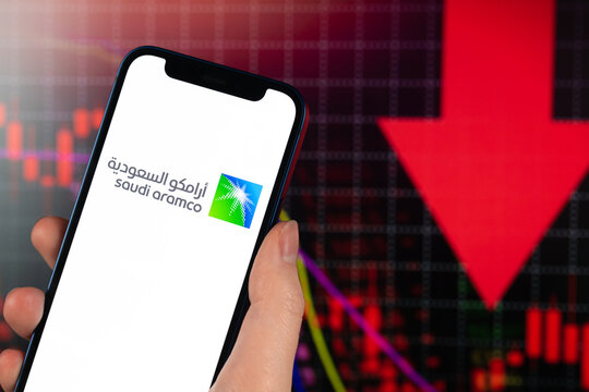 Saudi Aramco stock trade on red chart. Arabian oil company, gas industry. Finance market background photo