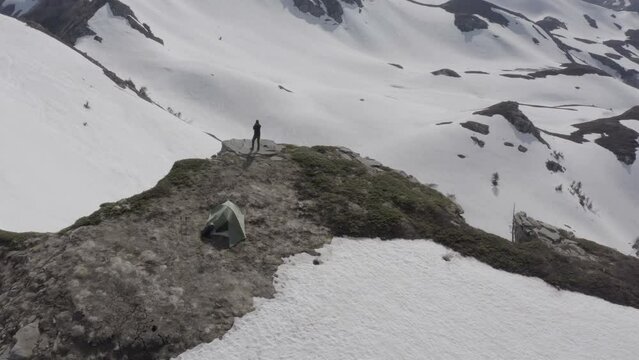 Wild camping on top of snow covered mountains