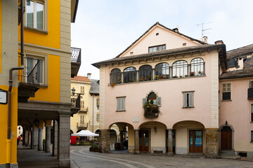 Fototapeta na wymiar View of central Market Square with colorful houses in historic center of small Italian town of Domodossola on winter day..