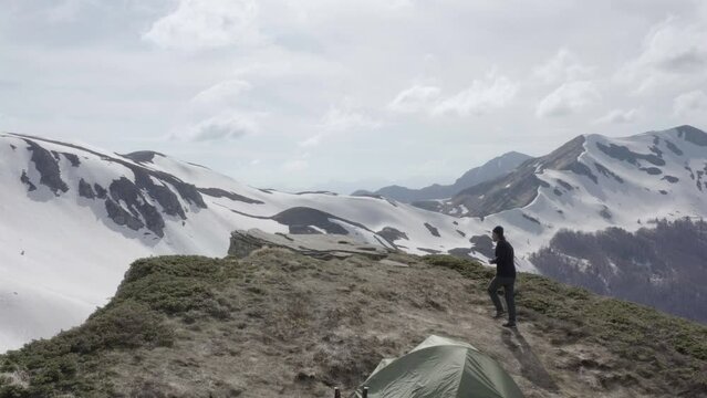 Extreme wild camping on top of snow covered mountains