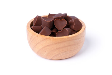 Milk chocolate in heart shaped in wooden bowl isolated on white background.