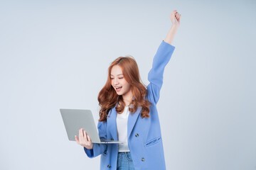 Young Asian businesswoman using laptop on white background