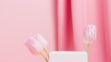 Banner with cube podium with tulips on pink background. Display for product presentation and ad