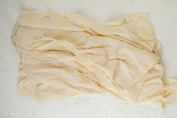 Obraz premium Homemade phyllo dough thin sheets. top view