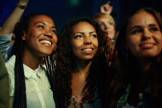 Captivated By The Music. Audience Members At A Concert.