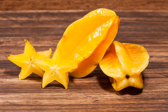 Averrhoa Carambolo - Star Fruit Or Carambola; Photo On Wooden Background