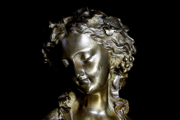 Obraz premium Antique Spelter Art Deco Bust on a Black Background
