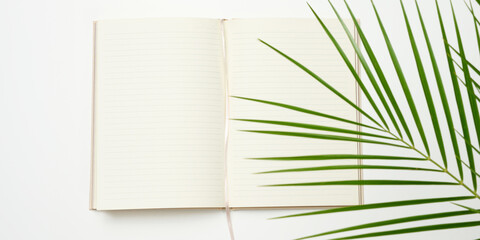 open notebook with blank white sheets on a white background