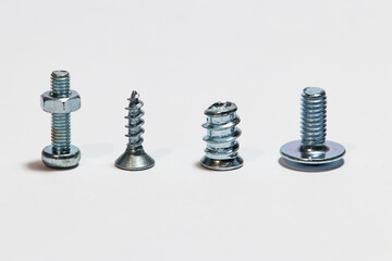 four different screws positioned vertically on a white background
