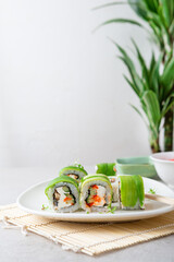 Sushi with cheese and avocado on plate copy space