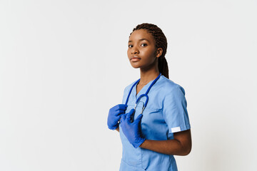 Young black doctor wearing uniform posing with stethoscope
