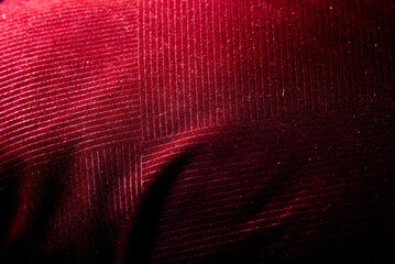 Bright red velvet fabric background with fine silk pattern
