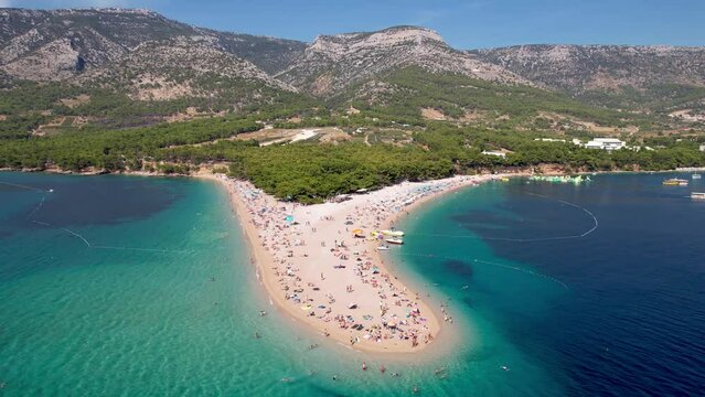 Aerial Close Orbit Vibrant Stunning Golden Horn Beach Peninsula Adriatic Sea Dark and Light Blue Waters Zlatni Rat Brac Island Croatia Summer Drone 4k