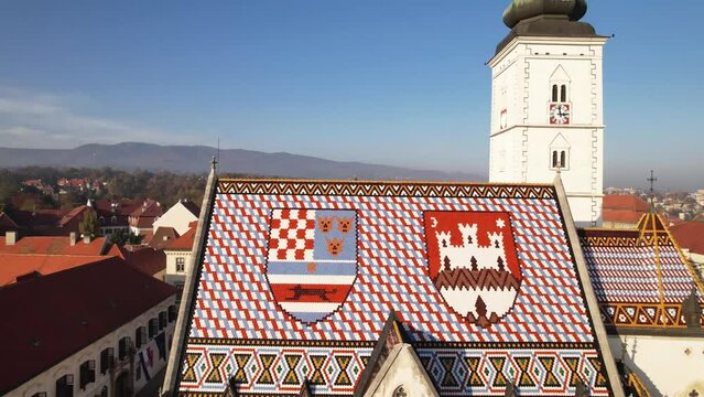 Aerial Break Away From Colorful Patterned Shield Roof of Iconic and Famous Saint Mark's Church Zagreb Croatia No People Crkva sv Marka Drone 4k