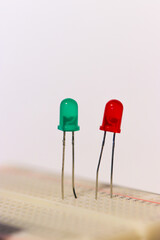 two green and red LEDs on a breadbord for electronic experiments 
