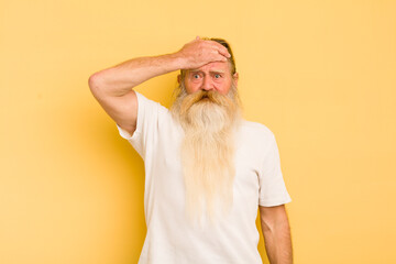 senior cool bearded man panicking over a forgotten deadline, feeling stressed, having to cover up a...