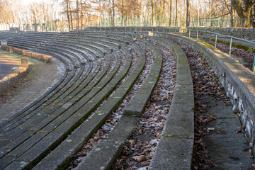 old concrete seats in a neglected sports stadium