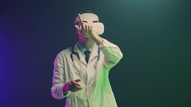 Doctor using VR goggle devices to operate virtually medical healthcare. Analyze, search and research from a case study for patients. Medical equipment technology and innovation concept.