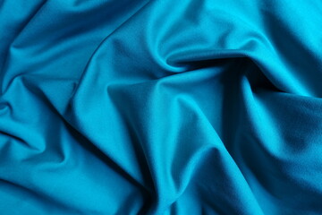 cerulean blue polyester fabric in soft folds