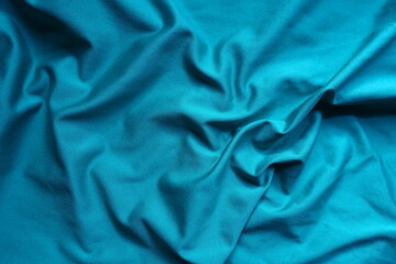 Draped cerulean blue polyester fabric from above