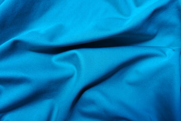 View of draped cerulean blue polyester fabric from above