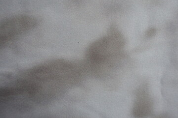 Texture of viscose and polyester fabric with tie dye pattern in shades of gray