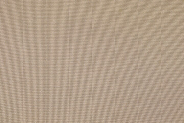 Fototapeta na wymiar Flat khaki-colored fabric texture background. This fabric is made of cotton and polyester.