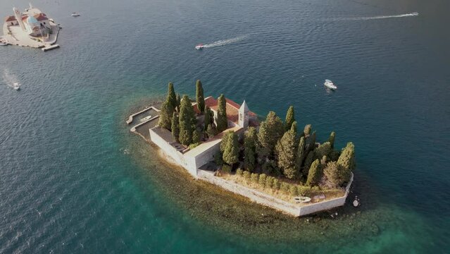 Aerial Partial Orbit Saint George Small Medieval Monastery Island in Adriatic Sea Bay of Perast Montenegro Summer Golden Hour Drone 4k