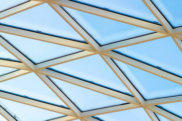 A fragment of a glass dome on the roof of the building. Geometric glass dome. Modern ceiling architecture