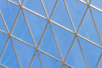 A fragment of a glass dome on the roof of the building. Geometric glass dome. Modern ceiling architecture