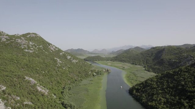 Aerial Rise Above Lush Green River Mountain Range Lake Skadar Montenegro Drone 4k