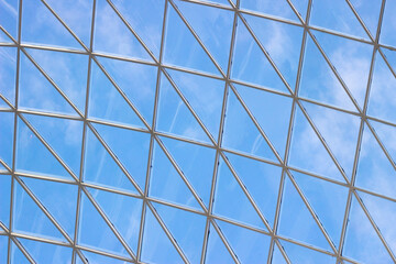 A fragment of a glass dome on the roof of the building. Geometric glass dome. Modern ceiling architecture