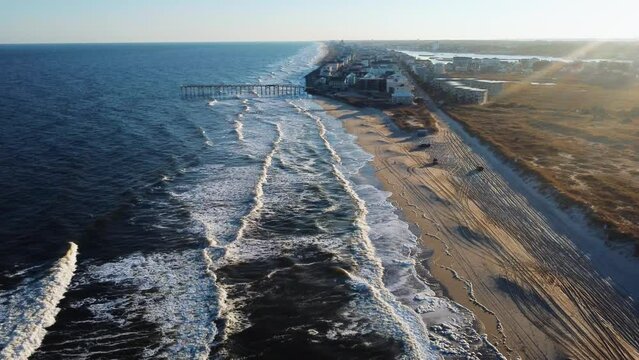 Freeman Park is a 4-wheel drive beach is located in Carolina Beach, NC right next to the North End Pier. People enjoy driving onto the beach with their dogs, grills, etc. to relax, surf, play, or tan.