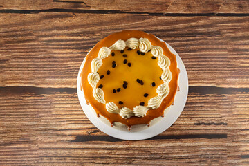 Passion fruit cake on a wooden table